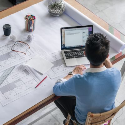 Young chineese engineer working in office